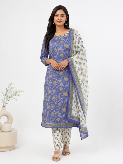 A woman modeling a traditional Indian salwar kameez suit set. The set features a Royal-blue printed kurta , matching printed trousers, and a white dupatta with a  border and floral print.